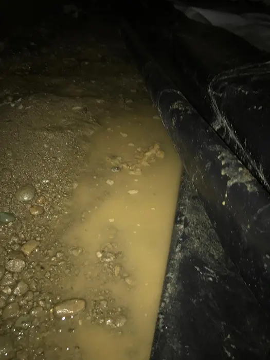 Standing water in a crawl space under a Kannapolis, NC home