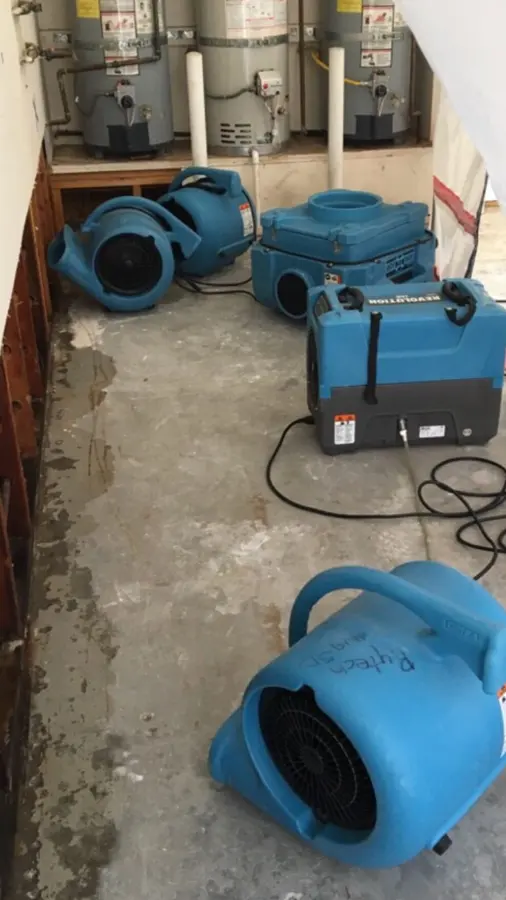 Air movers and dehumidifiers drying a Kannapolis, NC room
